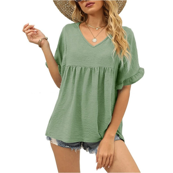 Black relaxed casual top with subtle frill details at the neckline and a flowing summer silhouette