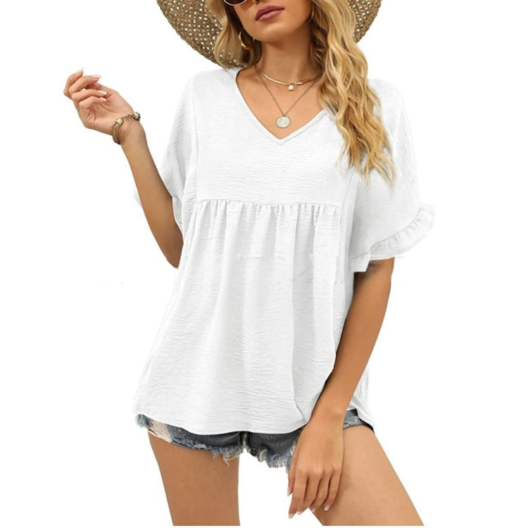 Black relaxed casual top with subtle frill details at the neckline and a flowing summer silhouette
