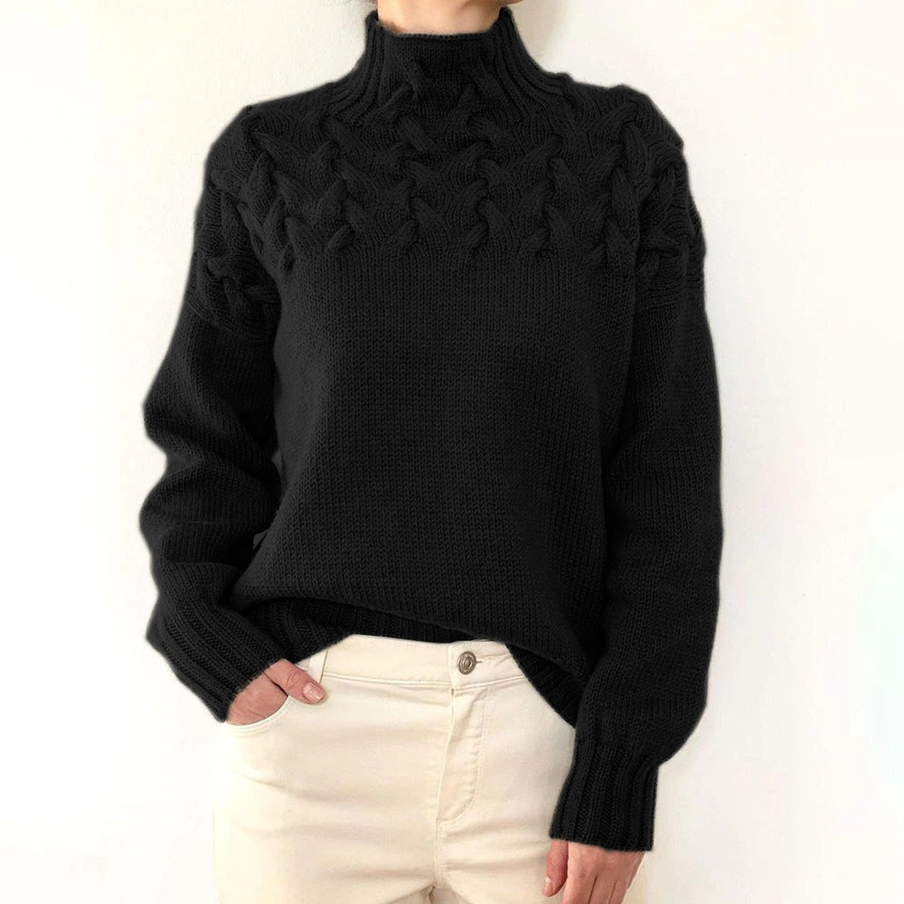 A woman wearing a warm roll-neck jumper, cosy and elegant on a cold winter day.