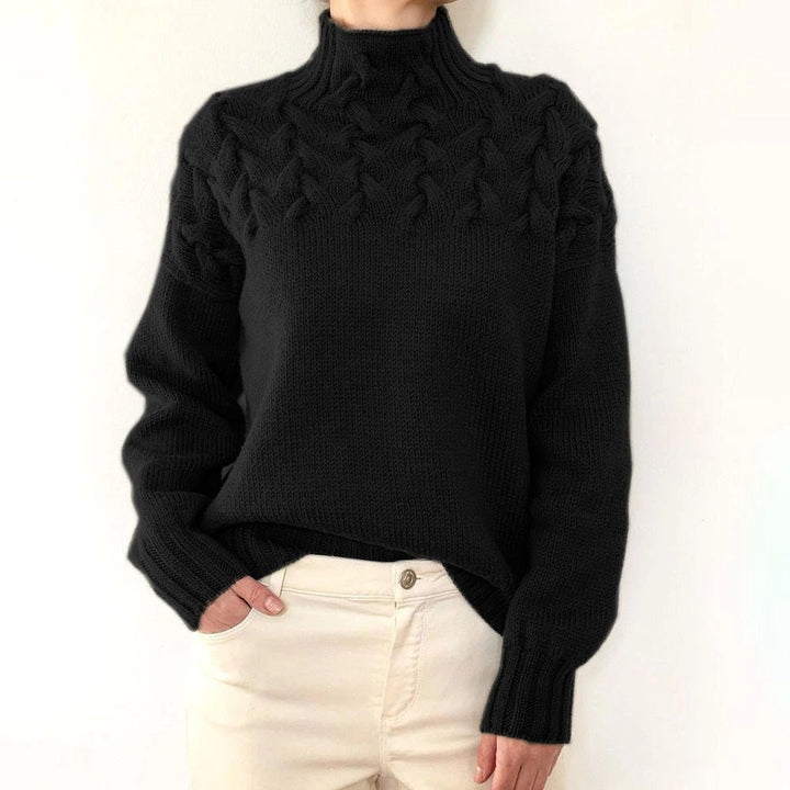 A woman wearing a warm roll-neck jumper, cosy and elegant on a cold winter day.